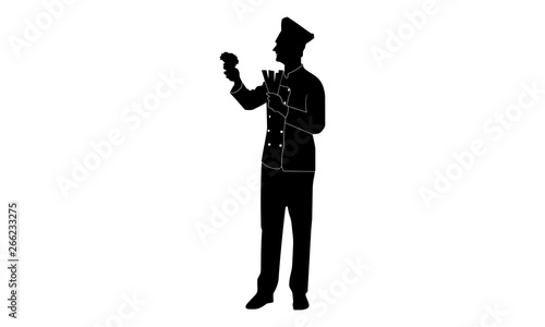 the silhouette of the chef holding the vegetables looks sideways