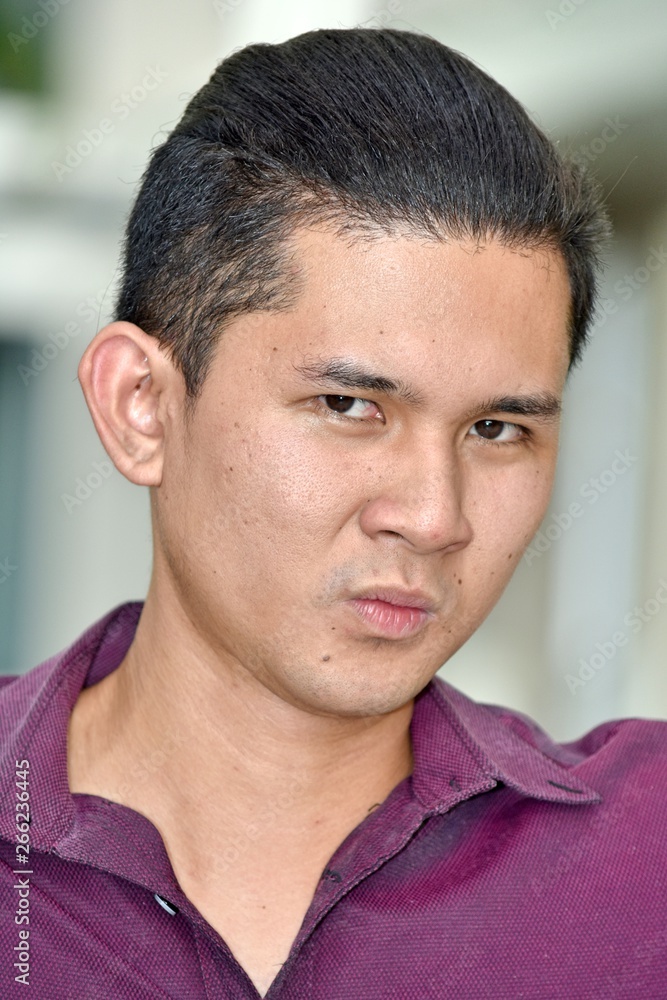 Obraz premium Confused Handsome Filipino Person