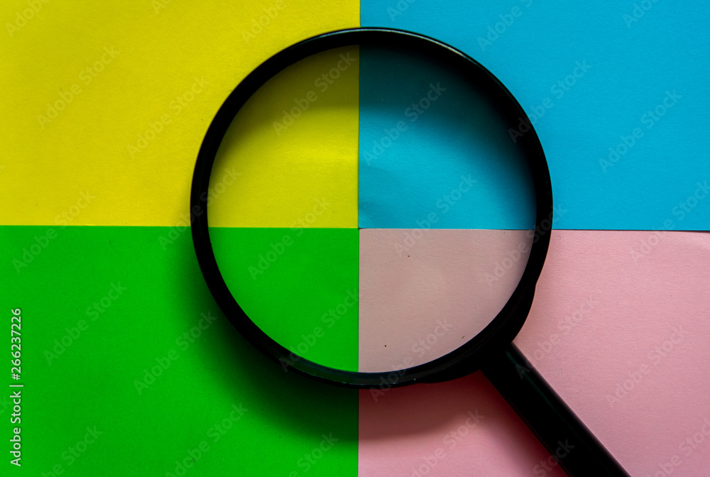 magnifier glass on colorful and abstract background magnifier glass on colorful and abstract background
