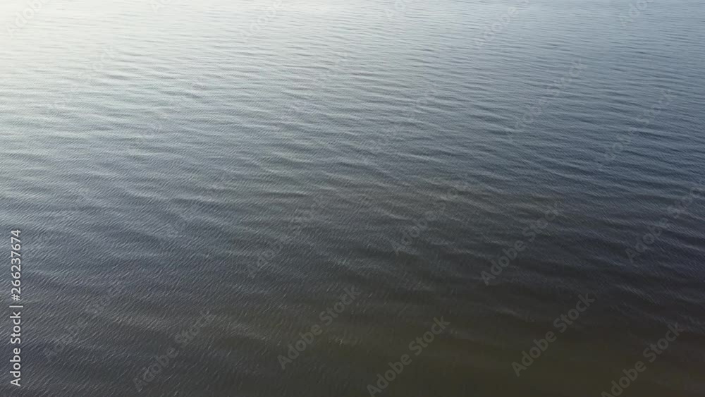 flying over sea in summer day, water texture with small waves in summer day flying over sea in summer day, water texture with small waves in summer day