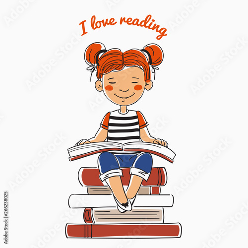Cute, funny girl reads a book sitting on a stack of books