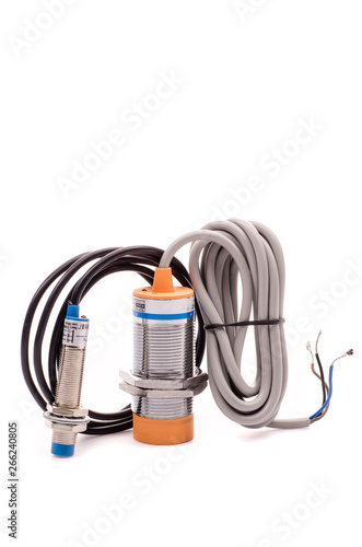 Inductive proximity sensor or proximity switch installed on the machine.