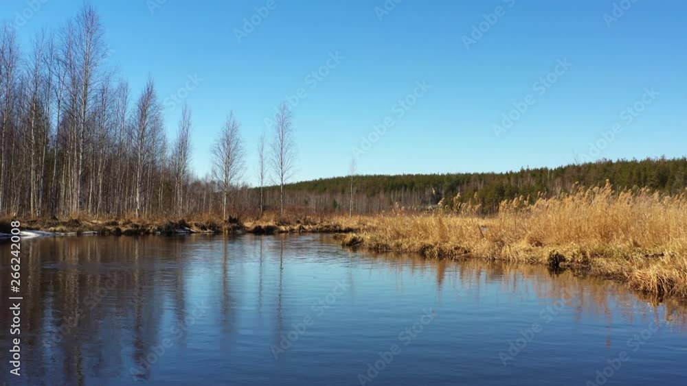 Flying over the river and the opening panorama of the field, forests and roads, aerial view. Flying over the river and the opening panorama of the field, forests and roads, aerial view.