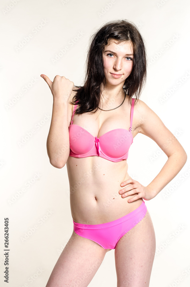 Young beautiful woman in a fashionable linen luxury brunette in the Studio Young beautiful woman in a fashionable linen luxury brunette in the Studio