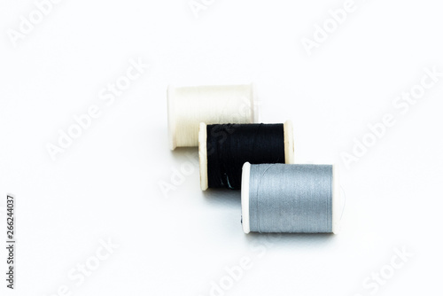 Multi-colored thread for sewing ,white background.