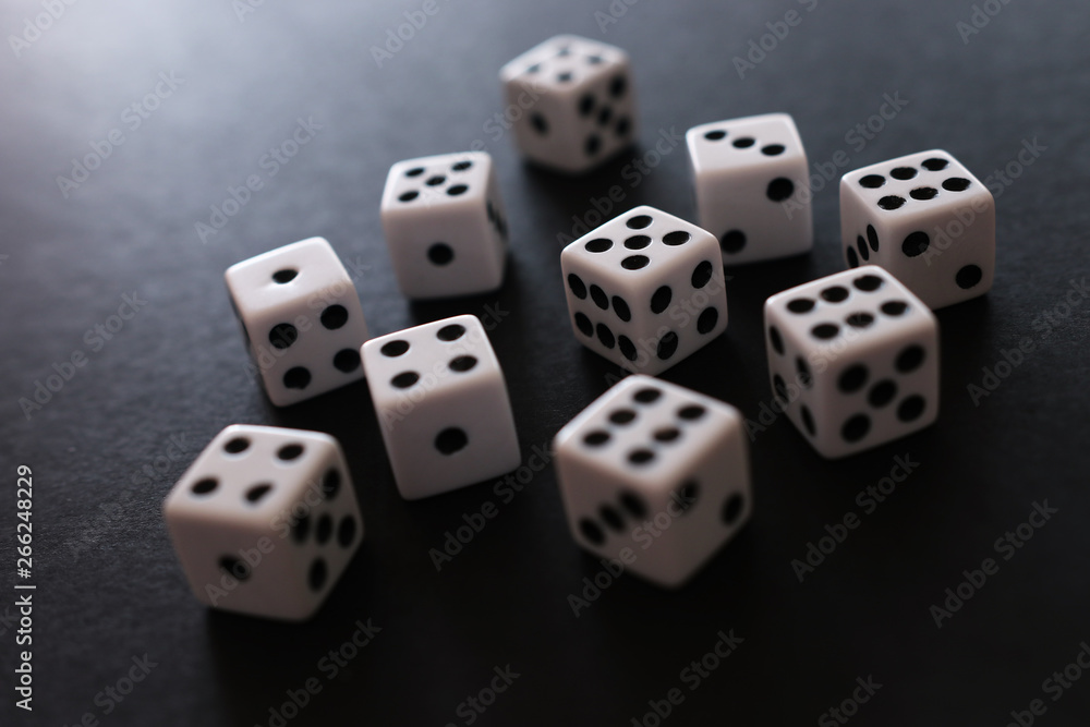 Rolling Dices over black background. Casino gambling concept Rolling Dices over black background. Casino gambling concept
