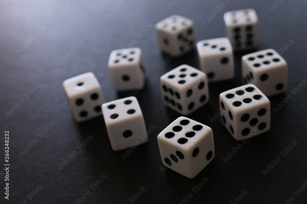 Rolling Dices over black background. Casino gambling concept Rolling Dices over black background. Casino gambling concept