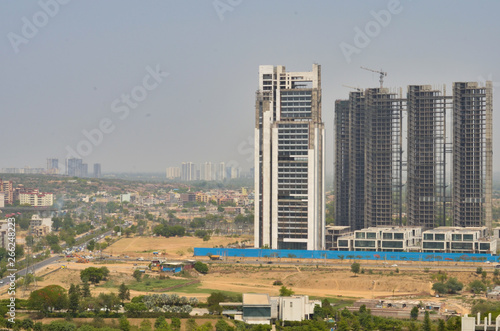 Aerial shot of highrise luxury apartments/office with under construction buildings at the background in Delhi NCR, Mumbai, Pune, Hyderabad, Lucknow, Jaipur, Kolkata, Noida, Gurgaon, Chennai, Bangalore
