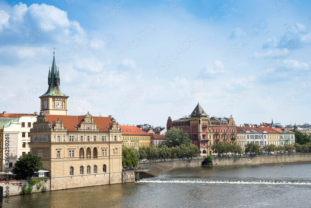 View from the Charles bridge to Smetana museum on the right bank of the river Vltava in the Old Town of Prague with a stormy sky. It is dedicated to the famous Czech composer Bedrich.