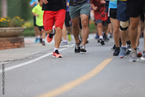 Group of people running race marathon