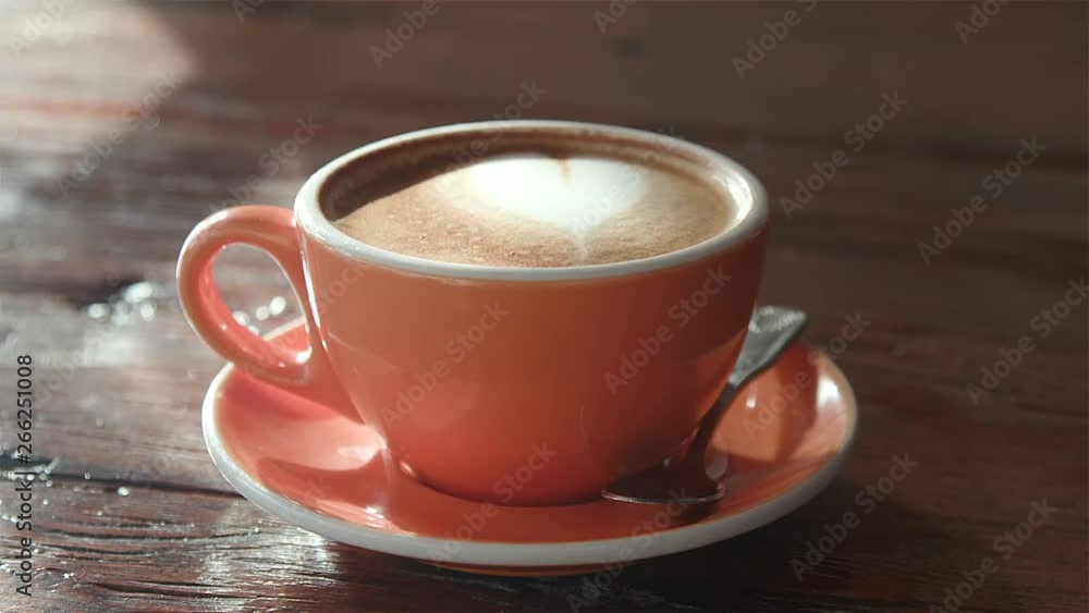 Cup coffee pushed into frame Cup coffee pushed into frame