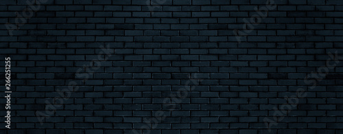 Black color brick wall for brickwork background design . Panorama format . photo