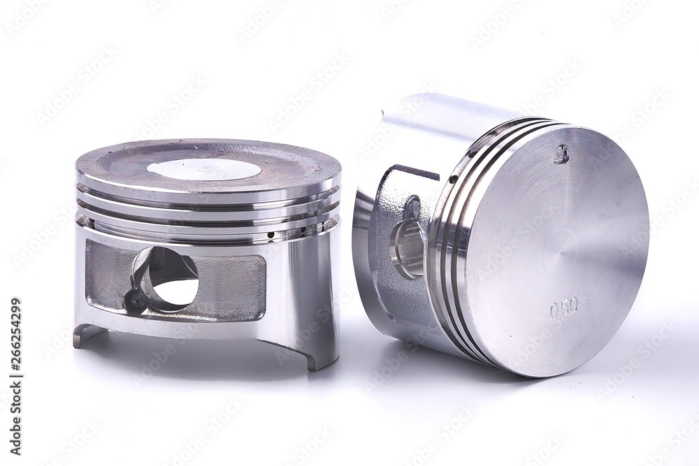The piston of the engine is on a white background. The piston of the engine is on a white background.