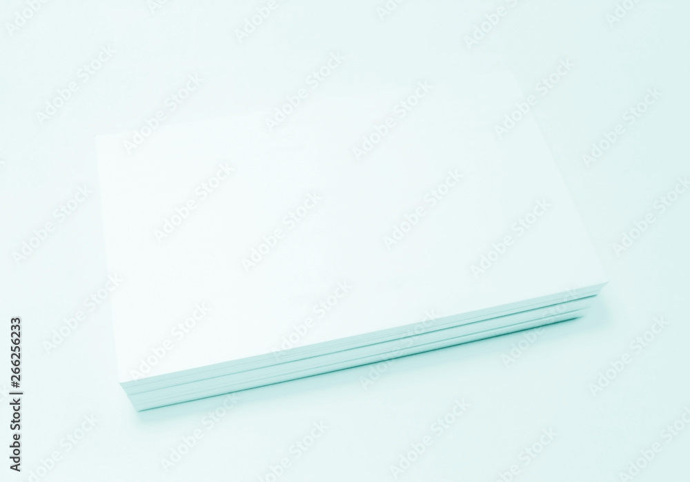 Mockup of business cards on white textured paper background Mockup of business cards on white textured paper background