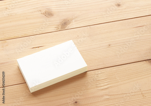 Mockup of business cards on wood textured background