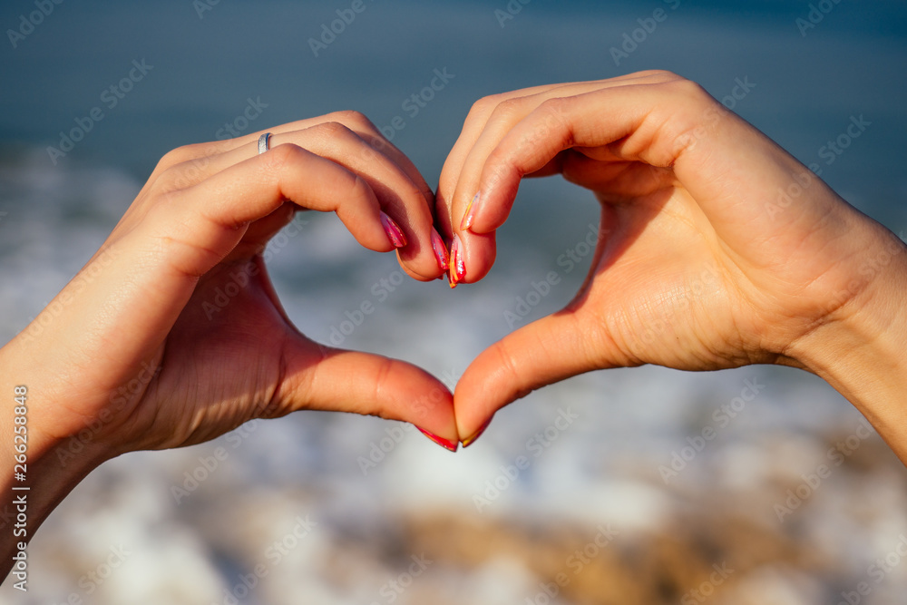 heart shape with hands on sunset Goa India heart shape with hands on sunset Goa India
