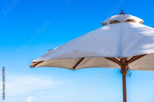 Umbrella and chair on the tropical beach and sea ocean