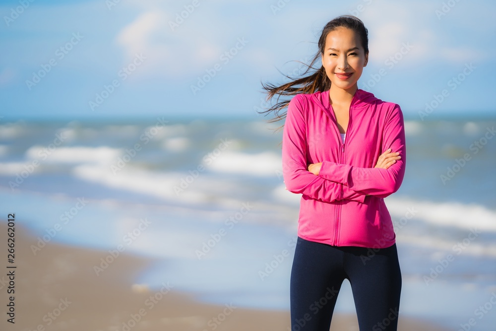 Portrait beautiful young asian woman running or exercise on the tropica nature landscape of beach Portrait beautiful young asian woman running or exercise on the tropica nature landscape of beach