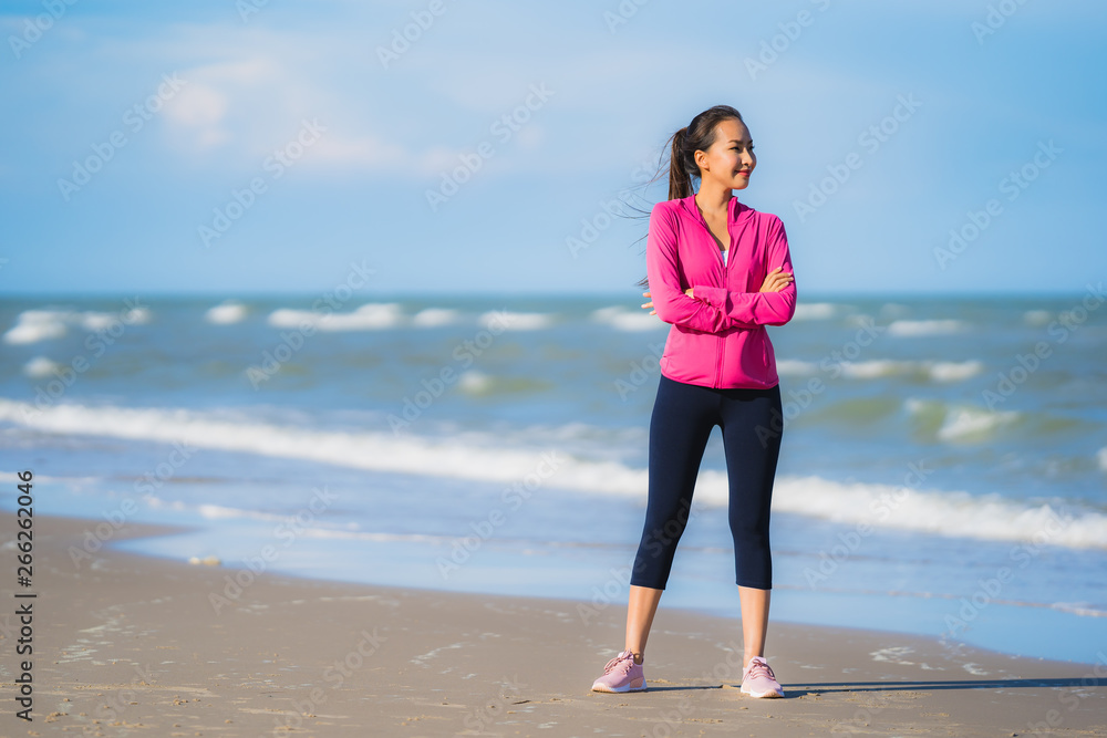 Portrait beautiful young asian woman running or exercise on the tropica nature landscape of beach Portrait beautiful young asian woman running or exercise on the tropica nature landscape of beach