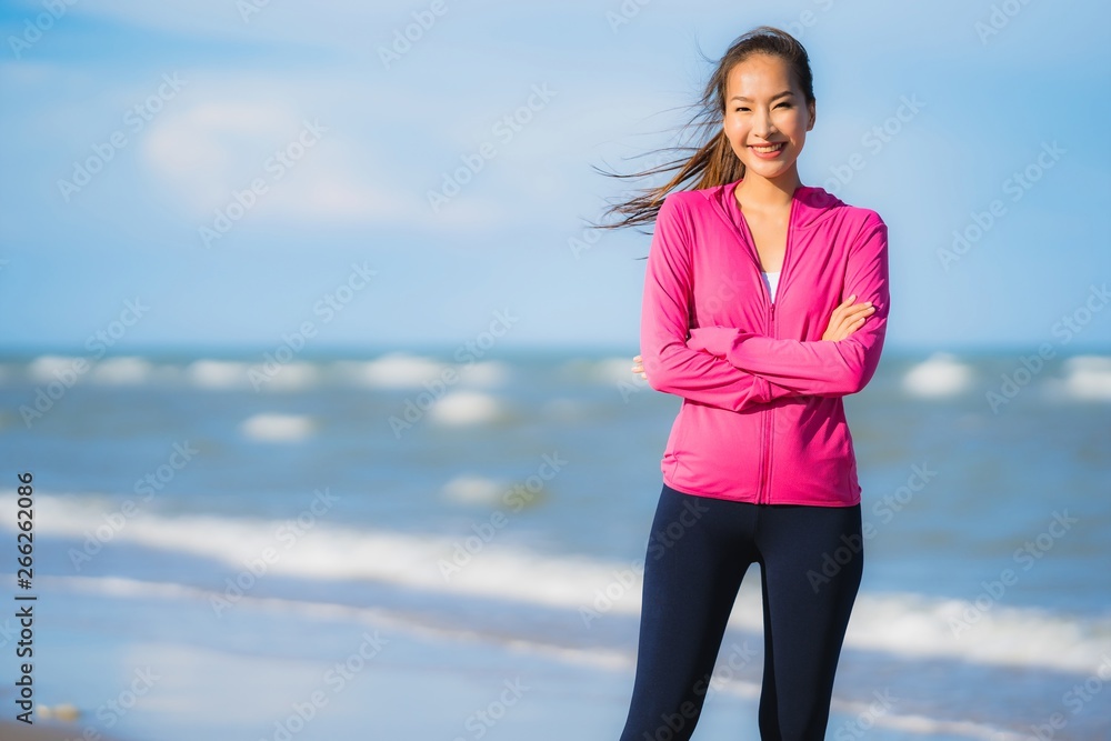 Portrait beautiful young asian woman running or exercise on the tropica nature landscape of beach Portrait beautiful young asian woman running or exercise on the tropica nature landscape of beach