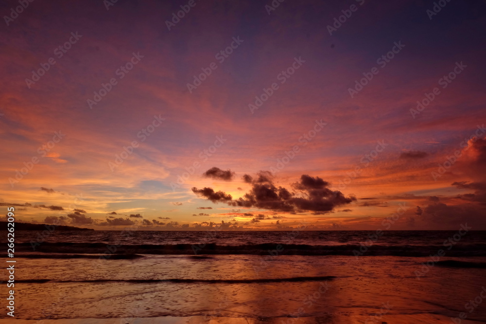 Fototapeta premium the beauty of Jimbaran beach in Bali Indonesia at dusk with the sun disappearing