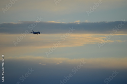 Cloudy sky with an approaching aircraft over the coast at Glenelg South Australia © Mike the Navigator