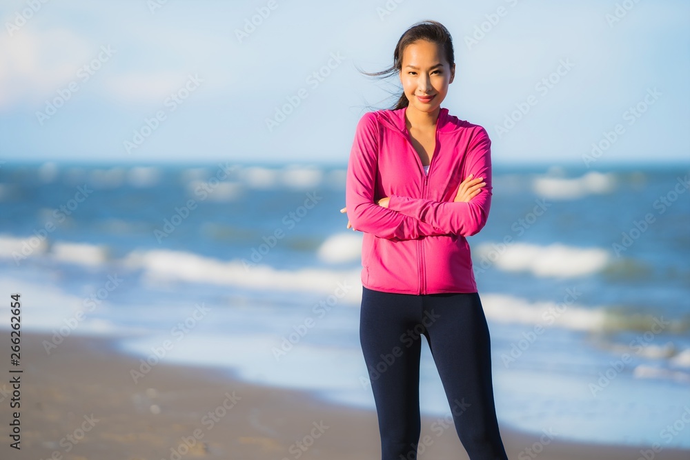 Portrait beautiful young asian woman running or exercise on the tropica nature landscape of beach Portrait beautiful young asian woman running or exercise on the tropica nature landscape of beach