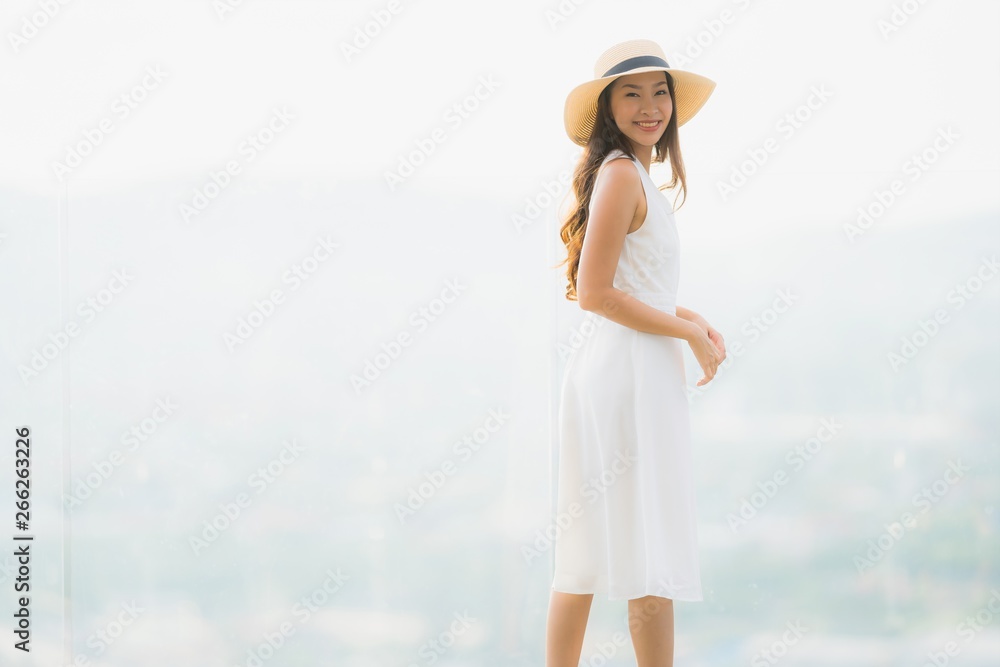 Portrait beautiful young asian woman smile happy and feel free with outdoor background
