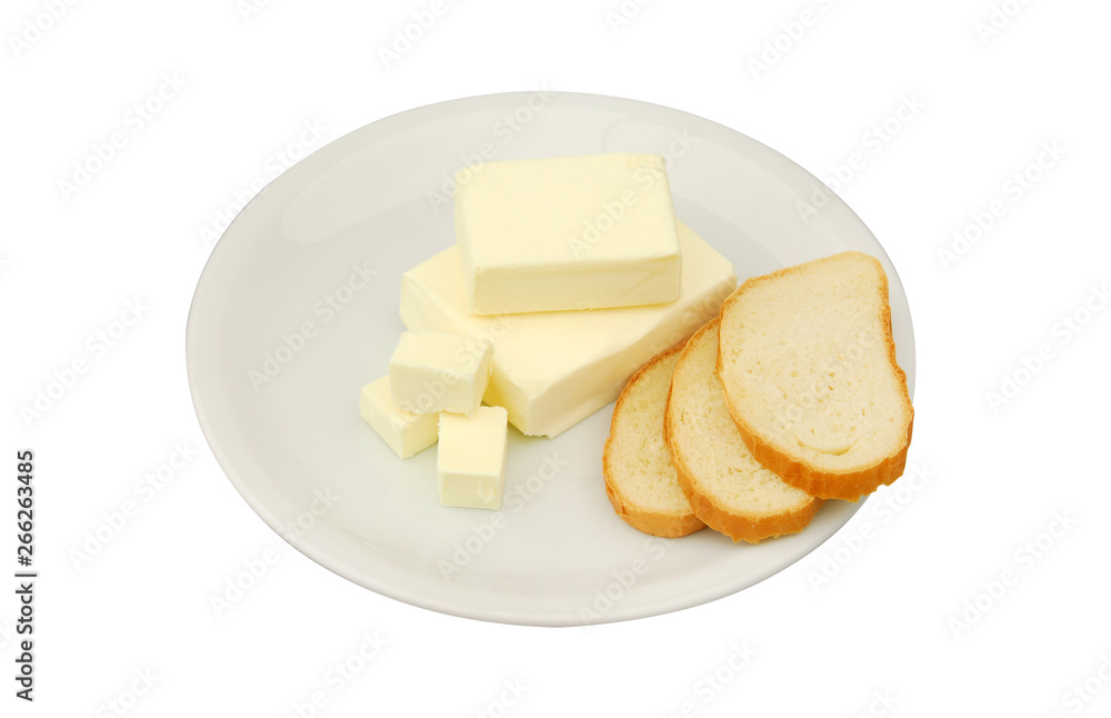 Butter and slices of bread are lying on a plate on a white isolated background Butter and slices of bread are lying on a plate on a white isolated background