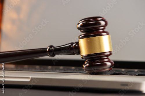 Closeup view of judje gavel on a laptop photo