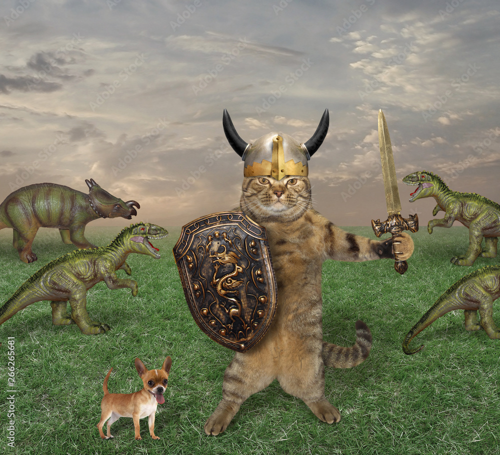 Fototapeta premium The cat warrior with a sword and a shield fights the dinosaurs in the field. His dog is next to him.