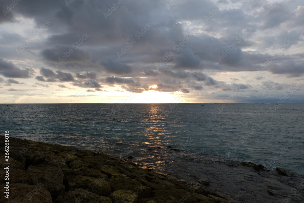 the beauty of panati Kuta Bali at dusk, with stunning orange and gold colors the beauty of panati Kuta Bali at dusk, with stunning orange and gold colors