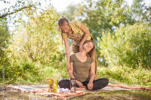 Master massage adequately performs a great massage in the woods. photo