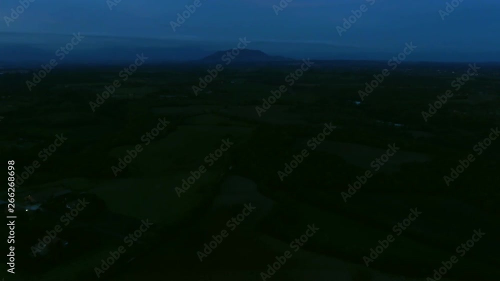 Aerial View of Foggy Landscape with Mountain at Night Aerial View of Foggy Landscape with Mountain at Night
