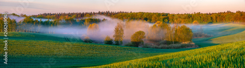 Obraz na płótnie panorama of a beautiful, ecological farmland at sunrise