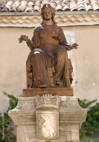 Bronze statue of miss Liberty on the Sault fountain. Provence, Frnace photo