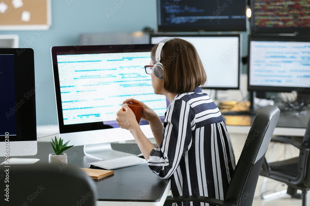 Female programmer working in office Female programmer working in office