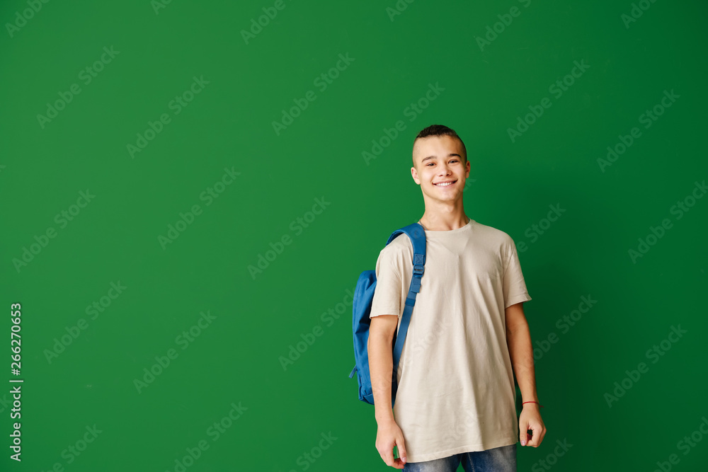 Cute teenage boy on color background Cute teenage boy on color background