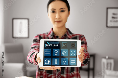 Young Asian woman using app...