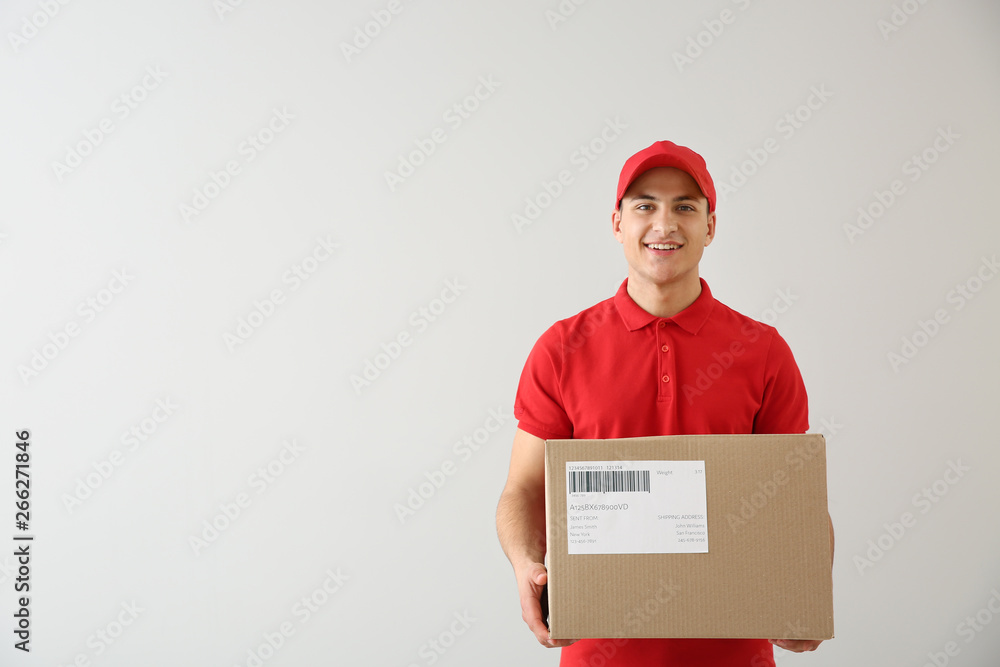 Delivery man with box on white background Delivery man with box on white background