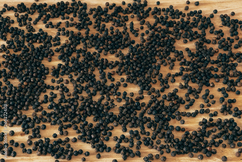 Pepper background, wooden table Pepper background, wooden table