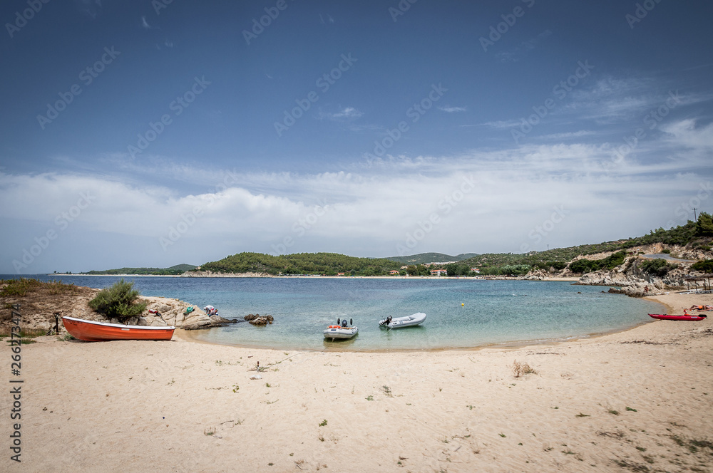 Obraz premium Halkidiki, Greece - June 27, 2014: A small cove and boats in a beautiful place of Chalkidiki