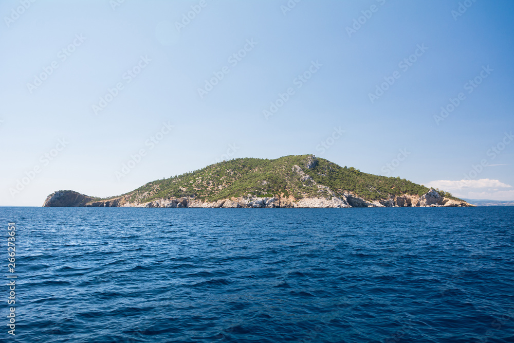 Neos Marmaras, Halkidiki, Greece - June 29, 2014: Kalymentos Island Turtle, uninhabited island near the peninsula of Chalkidiki
