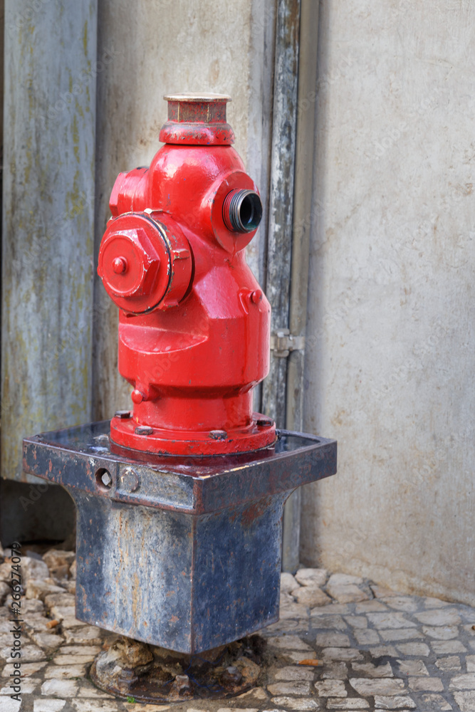 Old street fire hydrant to extinguish a fire in the street of the Portuguese capital of Lisbon Old street fire hydrant to extinguish a fire in the street of the Portuguese capital of Lisbon