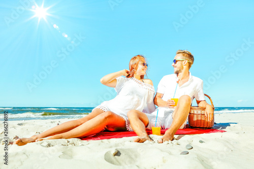 Young people on beach and free space for your decoration. 