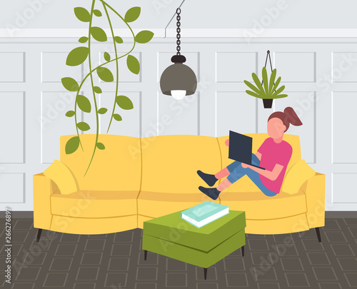 woman sitting on couch girl using laptop contemporary living room interior home modern apartment design flat horizontal full length