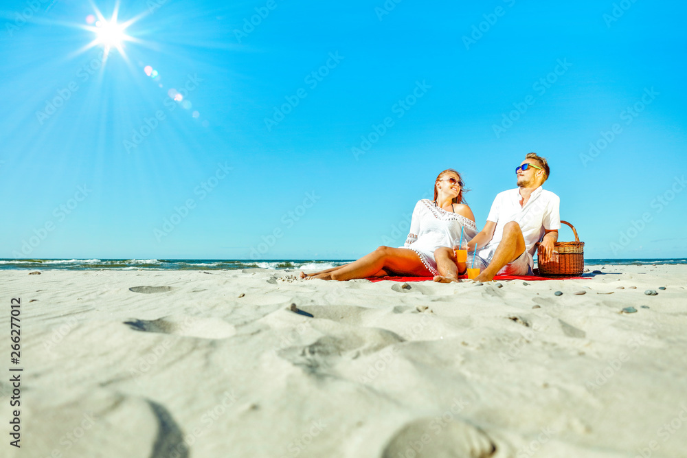Fototapeta premium Young people on beach and free space for your decoration. 