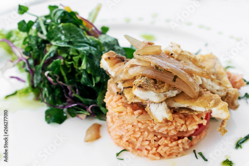 Portuguese fish in Escabeche sauce with tomato rice gourmet meal