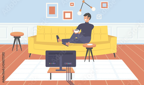 man sitting on couch watching tv guy drinking coffee having fun contemporary living room interior home modern apartment design flat horizontal full length