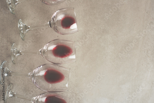 Red wine in transparent wine glasses on a betton background with space. Bojole nouveau, wine bar, winery, winemaking, wine tasting concept, Flat lay
